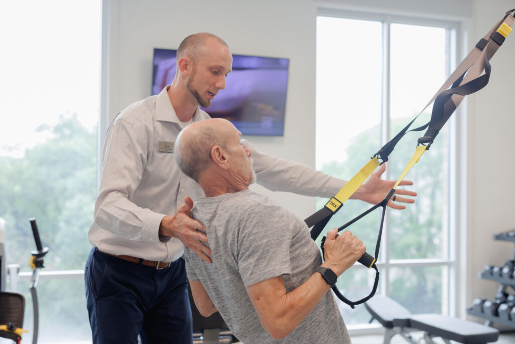 Senior resident with personal trainer